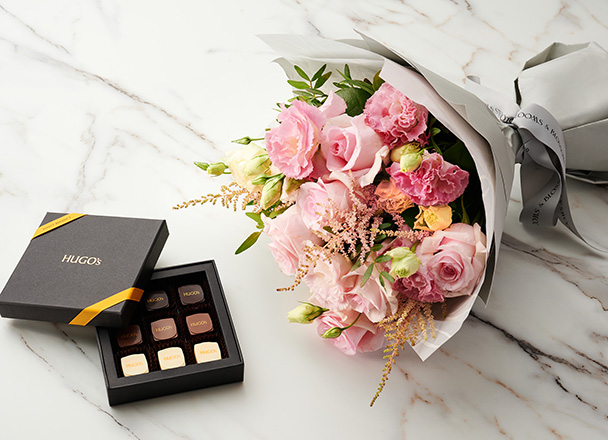 Impress your loved ones with Hugo’s pralines selection pairing with Bloom and Blossoms bouquet selections.
