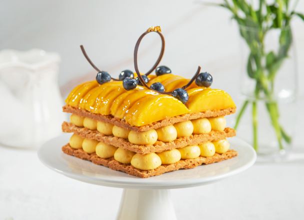 Three layers of delicate fresh butter puff pastry intertwining with layers of smooth and rich vanilla custard and fresh mango. Our signature version of the all-time classic.
