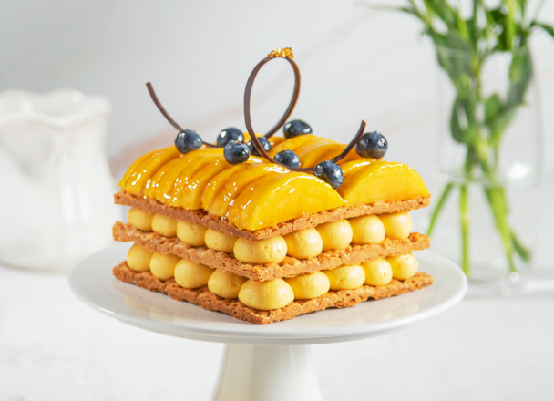 Three layers of delicate fresh butter puff pastry intertwining with layers of smooth and rich vanilla custard and fresh mango. Our signature version of the all-time classic.
